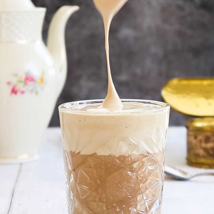 whipped coffee being added on top of coffee