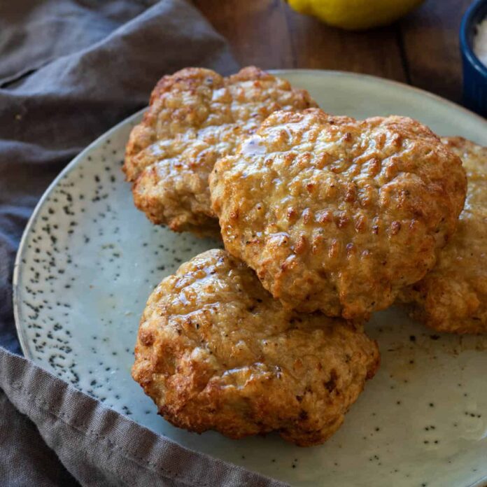 Chicken patties on a blue plate.