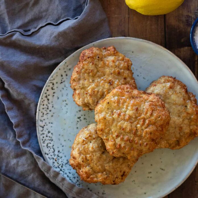 Chicken patties on a blue plate.