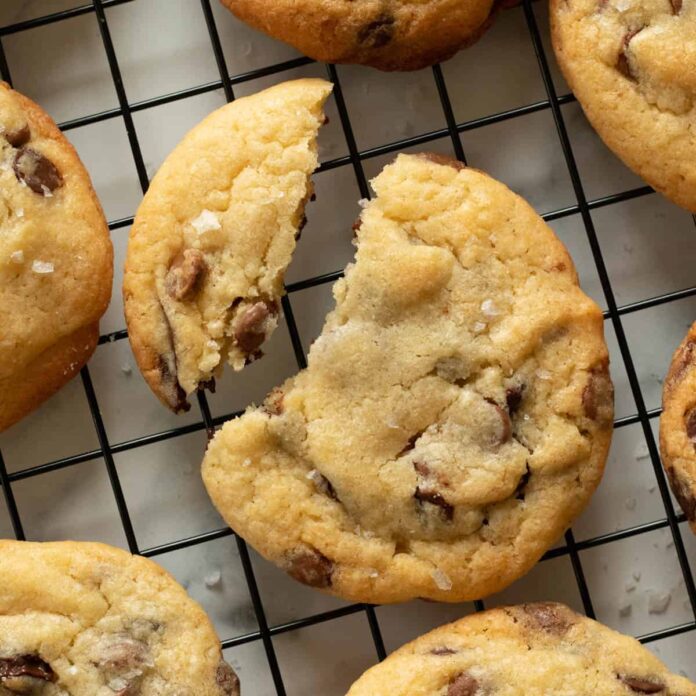 Chocolate chip cookies on a cooling rack.
