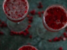 top view of three glasses filled with cranberry ginger ale punch