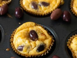 greek breakfast egg muffins in a muffin tin