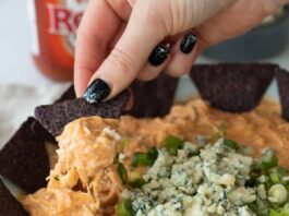 a chip loaded with buffalo chicken dip