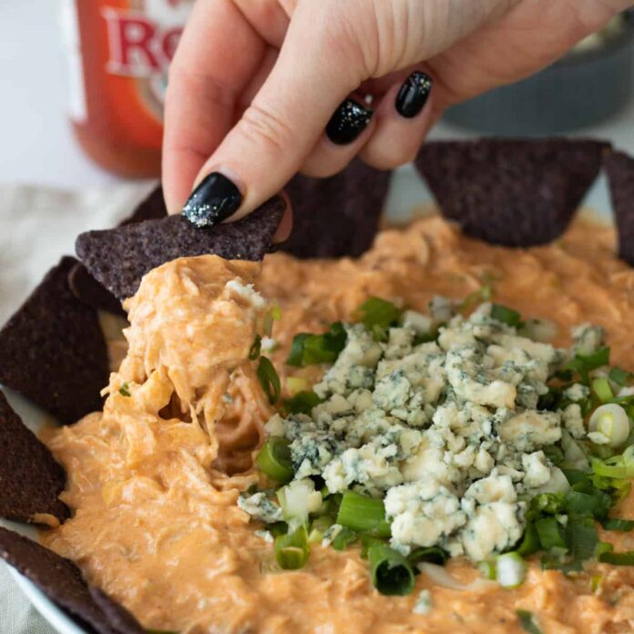 a chip loaded with buffalo chicken dip