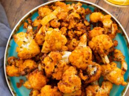 air fryer buffalo cauliflower on a blue plate