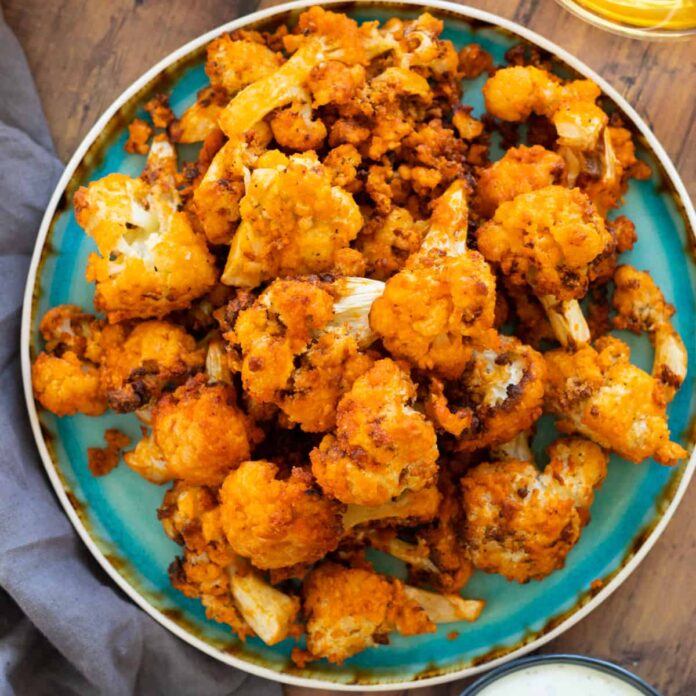 air fryer buffalo cauliflower on a blue plate
