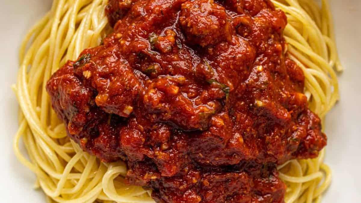 Accueilmade spaghetti sauce over pasta.